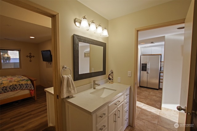 bathroom with vanity and wood-type flooring