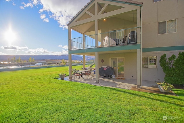 exterior space featuring a patio area and a balcony