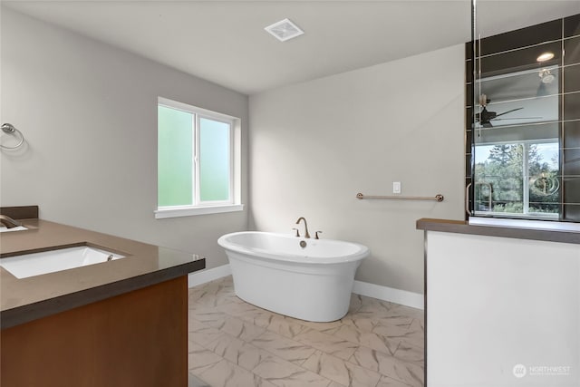 bathroom with vanity and a tub to relax in