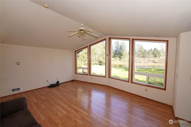 15614 Birch St, Long Beach, WA 98631 - unfurnished living room with ceiling fan, lofted ceiling, light wood-style floors, and visible vents