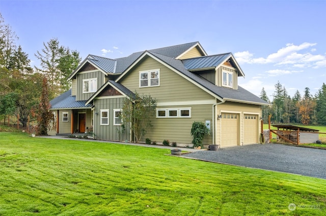 view of front of home with board and batten siding, a standing seam roof, driveway, and an attached garage