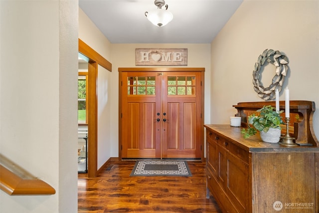 foyer entrance with dark wood-style floors