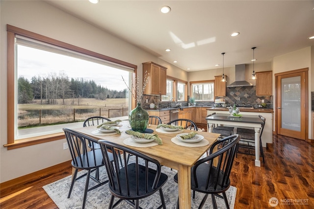 dining area with recessed lighting, dark wood finished floors, and baseboards