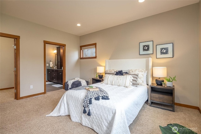 bedroom with recessed lighting, carpet flooring, baseboards, and ensuite bathroom