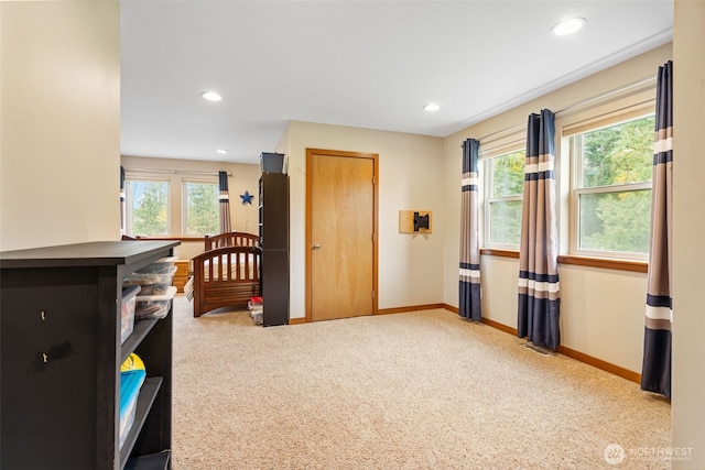 carpeted bedroom with multiple windows, recessed lighting, a closet, and baseboards