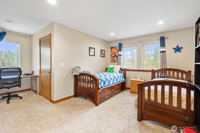 carpeted bedroom with recessed lighting, multiple windows, and baseboards