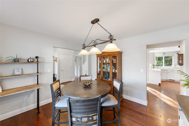 dining area with dark wood-type flooring