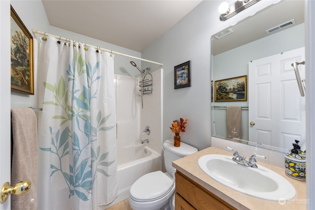 full bathroom featuring shower / bath combo, vanity, and toilet