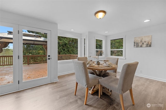 dining space featuring a wealth of natural light and light hardwood / wood-style floors