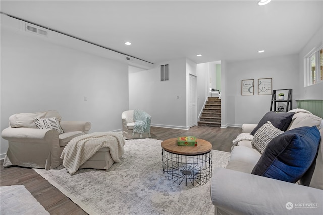 living room with dark hardwood / wood-style flooring