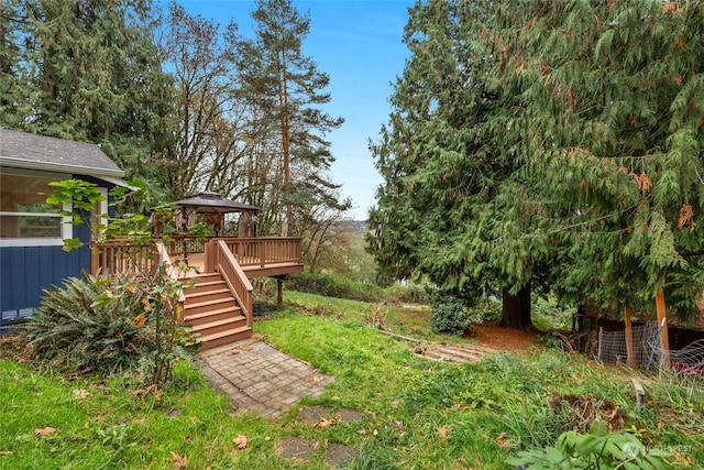 view of yard featuring a wooden deck