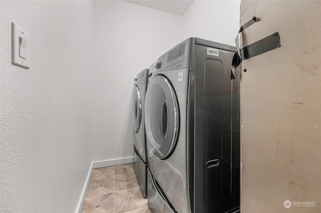 laundry area featuring washing machine and clothes dryer