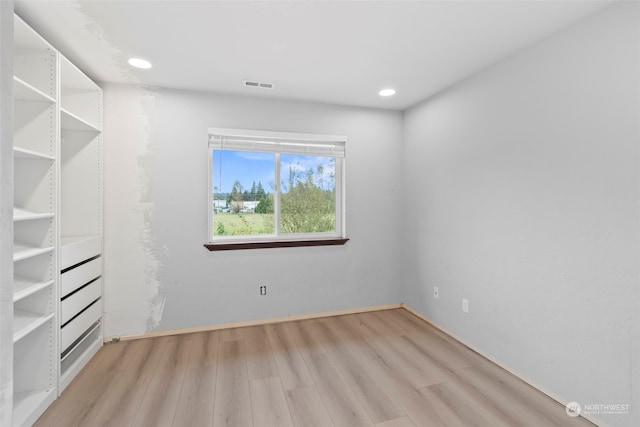 spacious closet featuring light hardwood / wood-style floors