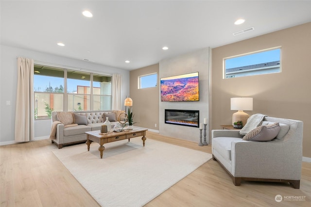 living room with light hardwood / wood-style floors