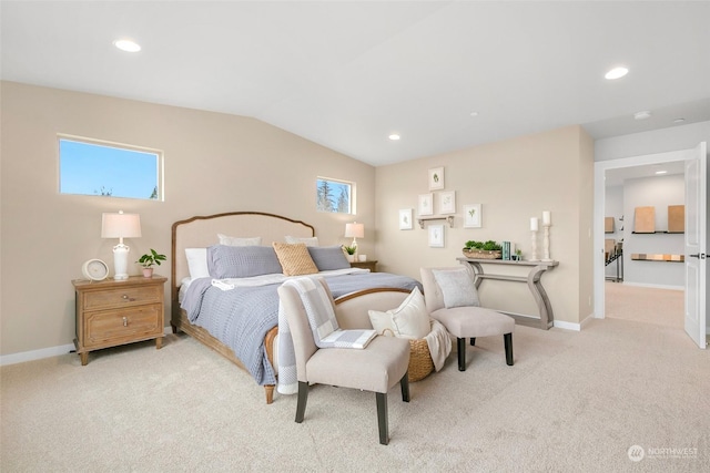 bedroom with light colored carpet, multiple windows, and lofted ceiling