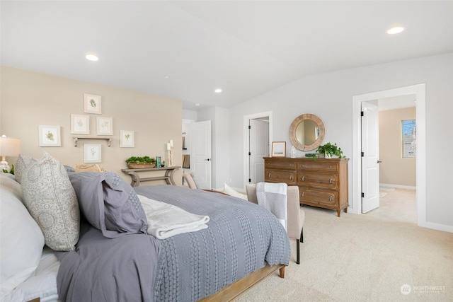 carpeted bedroom featuring vaulted ceiling