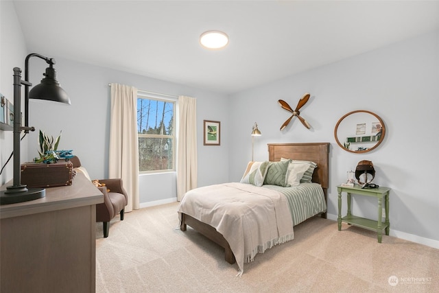 bedroom with light colored carpet