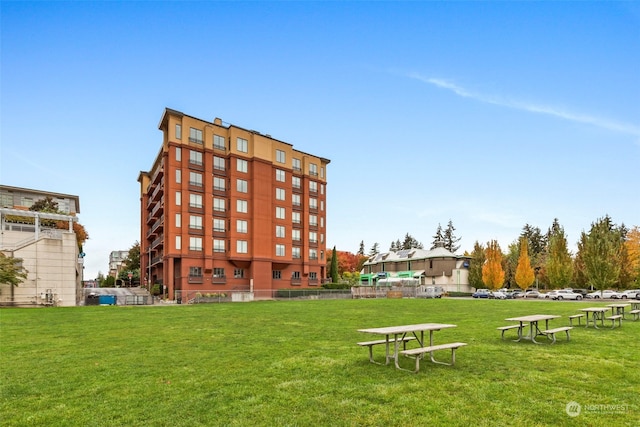 view of property's community with a lawn