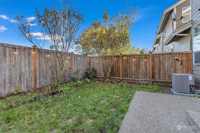 view of yard featuring central AC