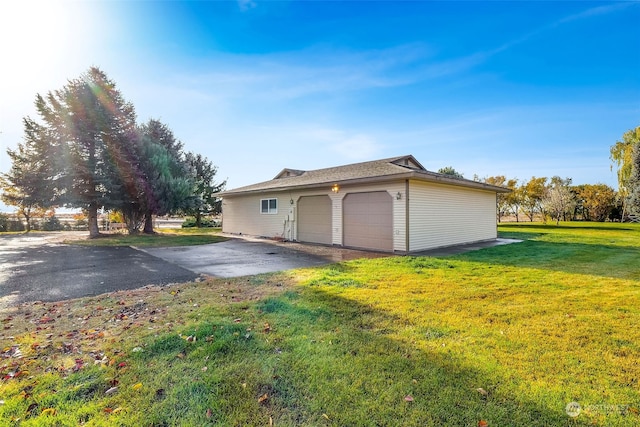 garage featuring a lawn