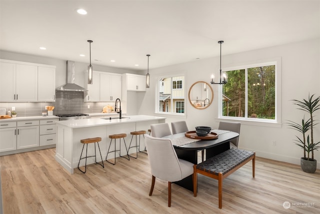 dining area featuring light hardwood / wood-style flooring and sink