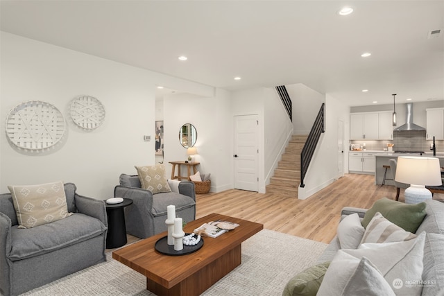 living room with light hardwood / wood-style floors