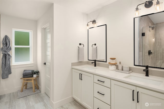 bathroom featuring tiled shower, vanity, and hardwood / wood-style flooring