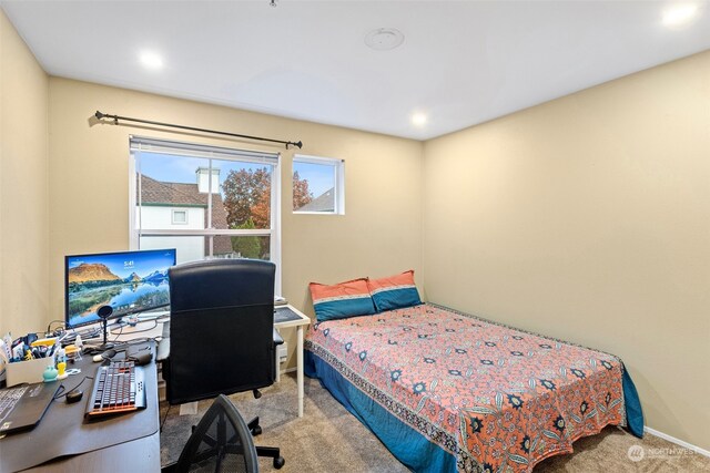 bedroom with light carpet