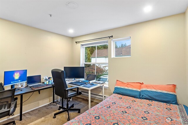 carpeted bedroom with a baseboard radiator