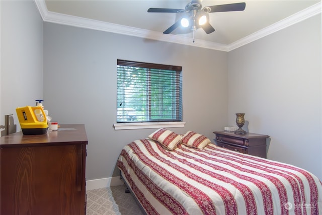 carpeted bedroom featuring ornamental molding and ceiling fan