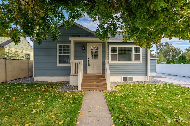 bungalow with a front lawn