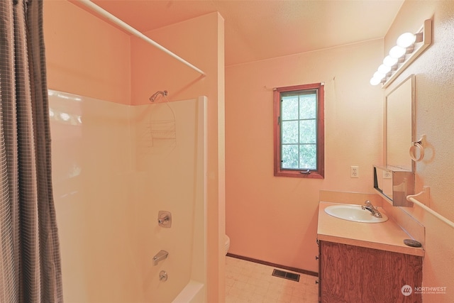 full bathroom featuring vanity, shower / bath combo, and toilet