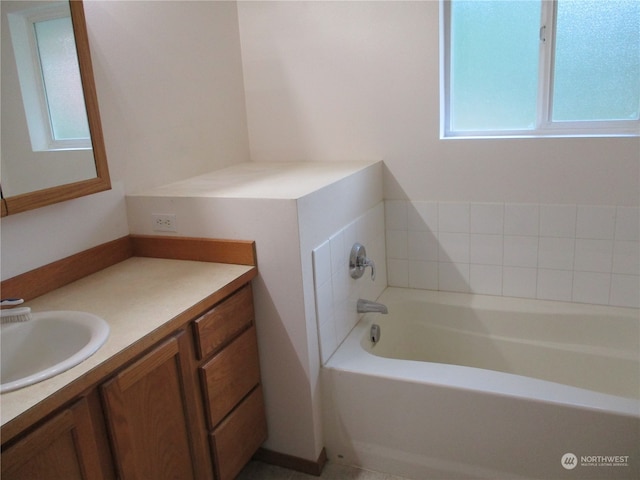 bathroom featuring vanity and a bathing tub