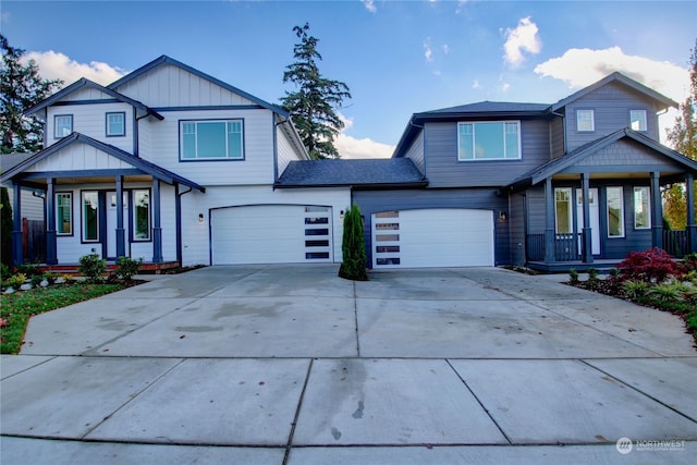 view of front of home with a garage and a porch