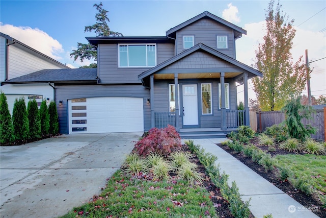 view of front of house featuring a garage and a porch