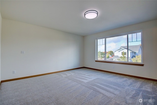 empty room featuring carpet flooring