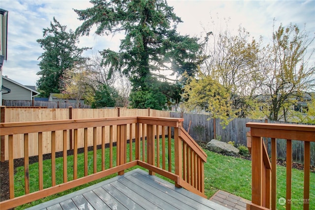 deck featuring a lawn