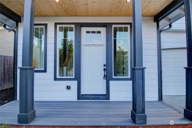 entrance to property featuring a porch