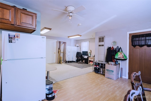 interior space with ceiling fan and light wood-type flooring