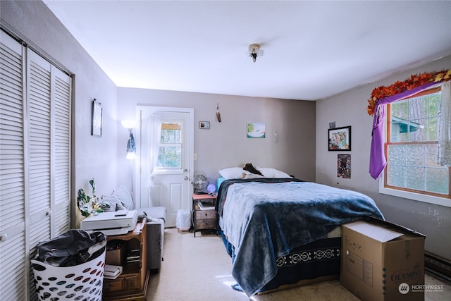 carpeted bedroom with a closet