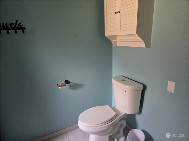 bathroom featuring tile patterned floors and toilet