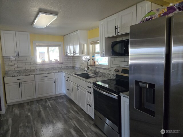 kitchen featuring sink, appliances with stainless steel finishes, white cabinets, and dark hardwood / wood-style flooring