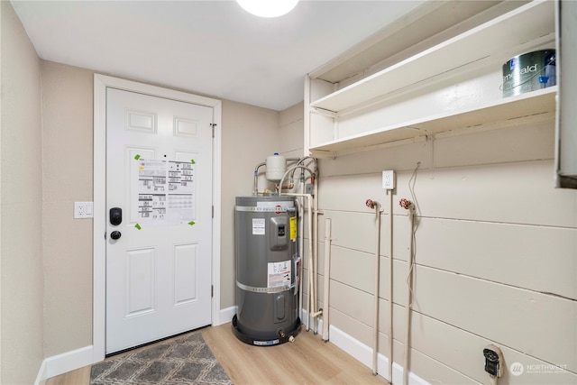 utility room with strapped water heater