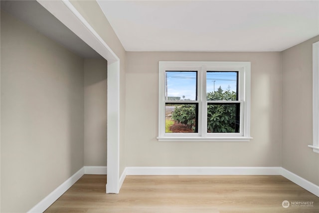 unfurnished room featuring light wood-type flooring