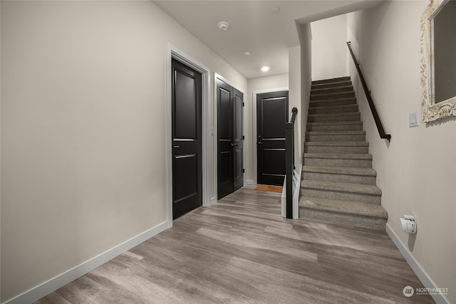 staircase featuring hardwood / wood-style floors