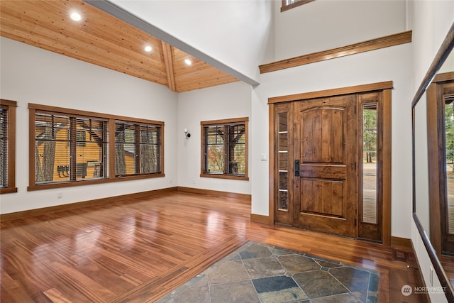 entrance foyer with beamed ceiling, wood ceiling, high vaulted ceiling, and dark hardwood / wood-style flooring