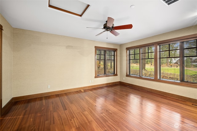 spare room with ceiling fan and wood-type flooring