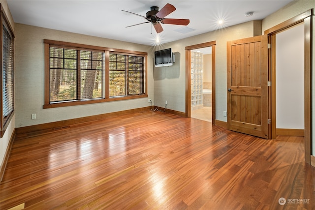 unfurnished room featuring hardwood / wood-style flooring and ceiling fan