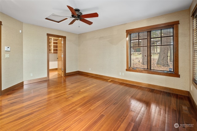 unfurnished room featuring ceiling fan and wood-type flooring