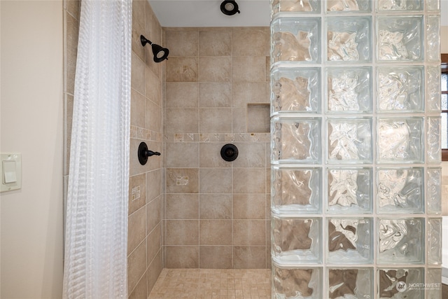 bathroom featuring a shower with curtain